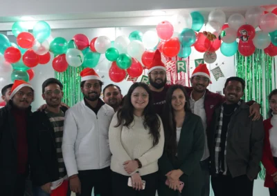 Team in Santa caps celebrating